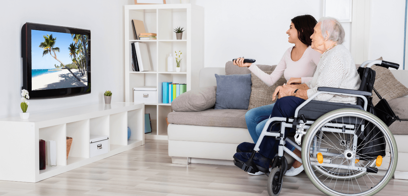 Senior residents enjoying television programming